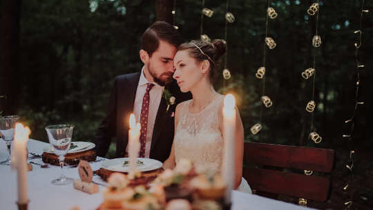 couple sitting at a gourmet dining table