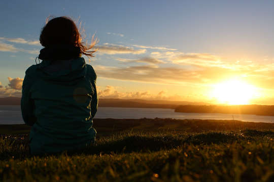 woman sitting outside peacefully