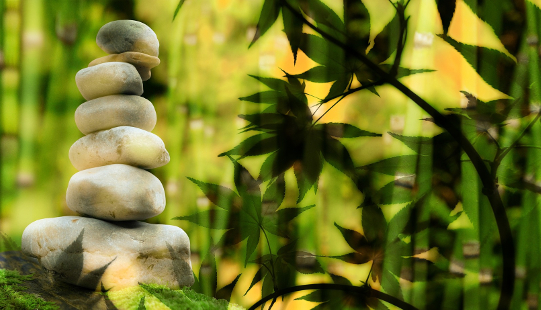 white stones balanced on each other in a peaceful setting