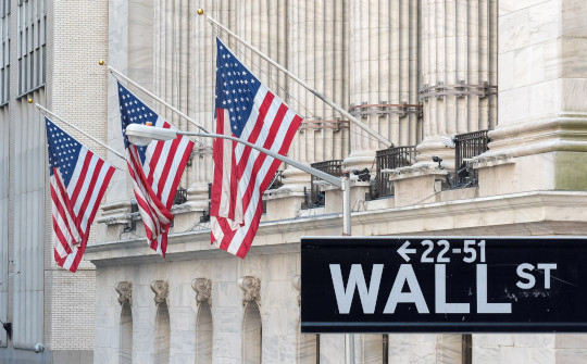 photo of wall street with American flags