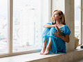 woman sitting by a window