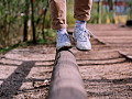 showing the feet and legs of someone balancing on one foot