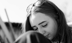 woman with eyes closed in reflection