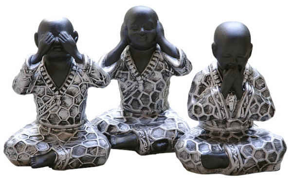 Three seated Buddhas in the classic see no evil, hear no evil, speak no evil positions