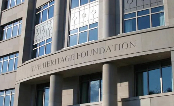 A depiction of the Heritage Foundation’s influence on U.S. governance showing how its policy blueprints have eroded democracy and concentrated power among elites.