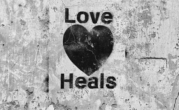 a heart with the words Love Heals