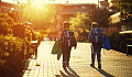 two young boys walking down the street by themselves