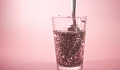 A glass of chia seed water with lemon slices, resembling the appearance of "tadpole water," highlighting its health benefits.