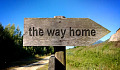 a signpost on which are written the words: "The Way Home"