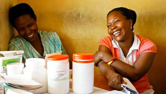 two women sitting laughing