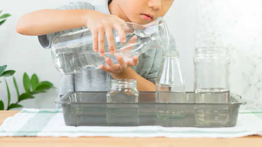 Pouring encourages the development of gross and fine motor skills.