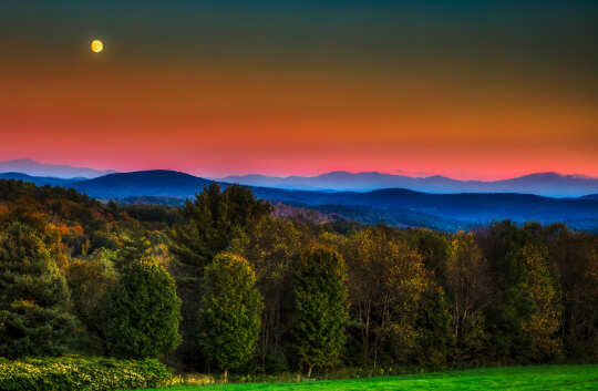 full moon over the mountains and forest of Vermont