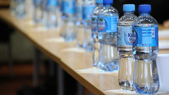 plastic bottles lined up on a counter