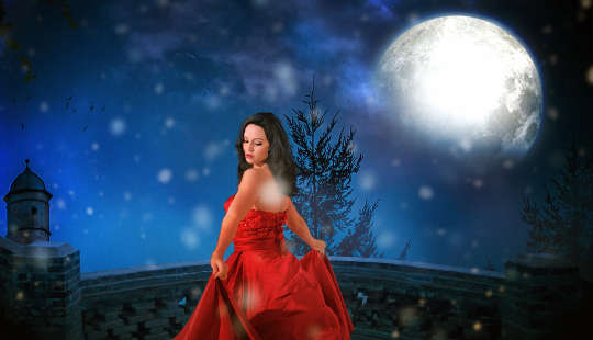 woman in a red dress under the light of the full moon