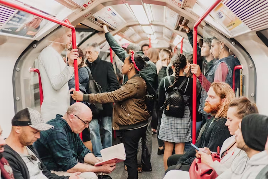 people going to work in subway car (or bus)