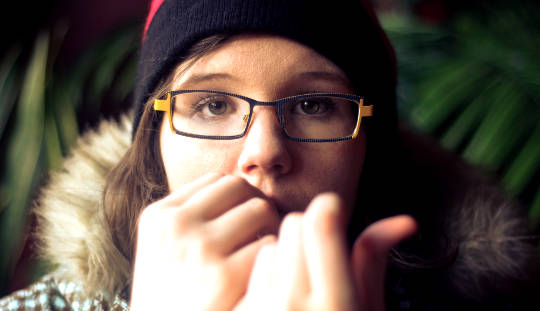 a young woman who seems stressed