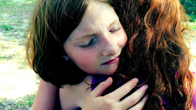 image of two young women hugging