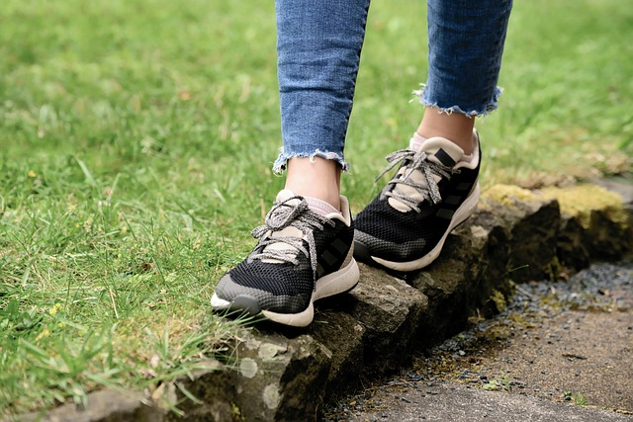 walking on a narrow stone wall