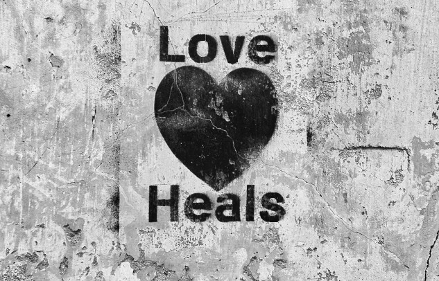 a heart with the words Love Heals