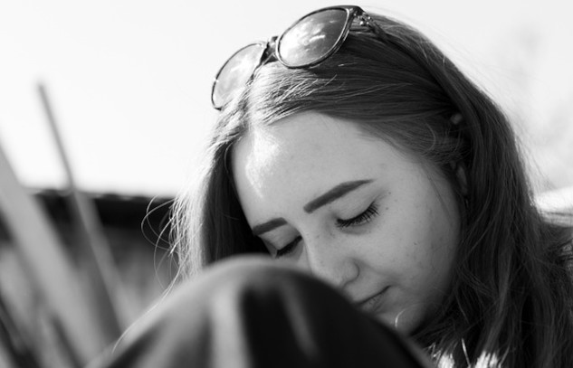 woman with eyes closed in reflection