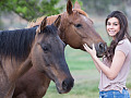 a young woman with two horses