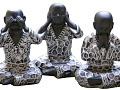 Three seated Buddhas in the classic see no evil, hear no evil, speak no evil positions