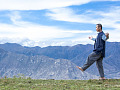 a man walking with arms wide open in a balanced pose