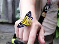 a butterfly sitting on a person's hand