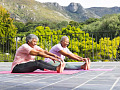 people doing stretching exercises outside