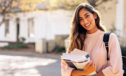 A college student reviewing books and career plans, representing the importance of choosing the right major.