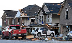 A home damaged by a hurricane, highlighting the rising cost of home insurance due to climate-related disasters.