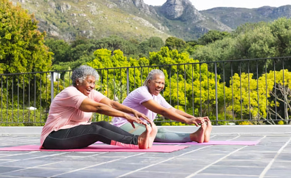 people doing stretching exercises outside