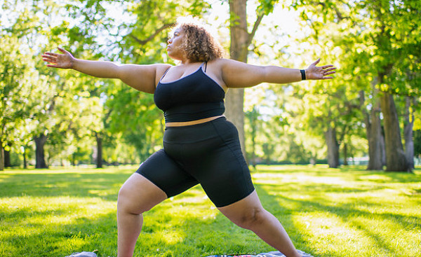 A runner on an outdoor path illustrating the connection between genetics and weight loss through exercise.