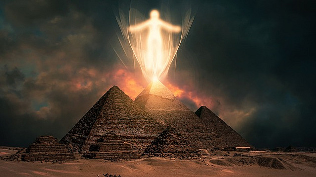 a ghostly figure above the pyramids