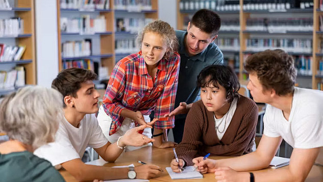 Students sharing stories about climate change and adaptation, highlighting the use of storytelling in education to connect young people with global climate issues.