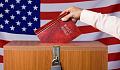 someone dropping a Bible into the ballot box in front of an American flag backdrop