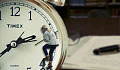 a woman climbing on a clock