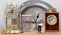 various clocks and watches all showing 15 minutes to 1